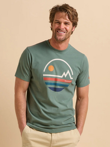 Man wearing a green t-shirt with a graphic design on a beige background