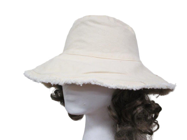 White bucket hat on a mannequin head against a white background