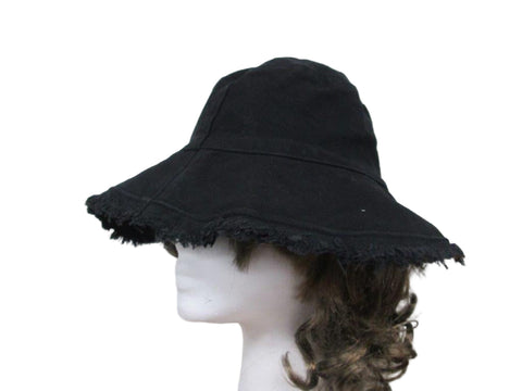Black wide-brimmed hat on a mannequin head against a white background