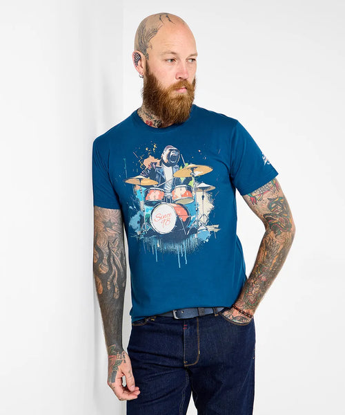 Man wearing a blue t-shirt with a gorilla playing a drum set graphic on a white background